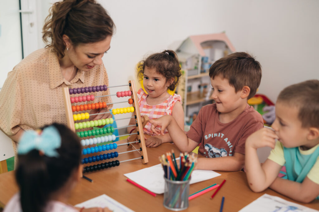 teacher teaching children in daycare